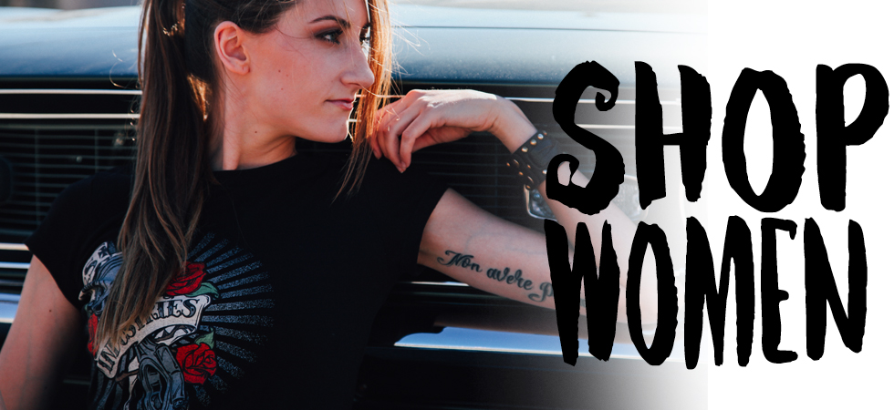Woman leaning on a classic car wearing a Bodie Stroud Industries tee