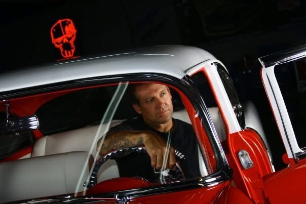 Bodie in the driver's seat of a custom truck