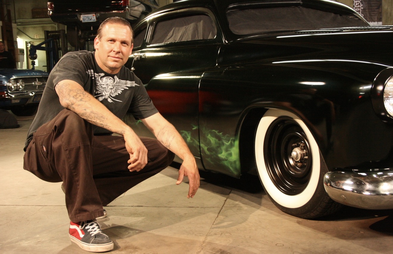 Bodie beside a finished custom car