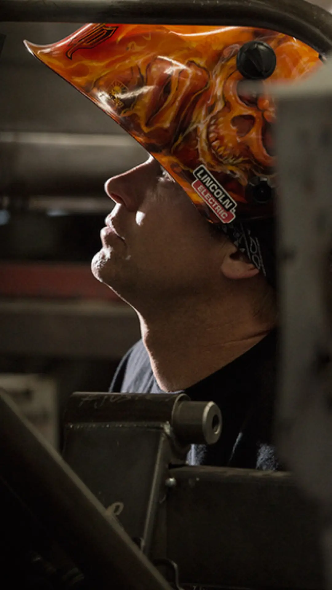 Bodie in a custom Lincoln welding helmet